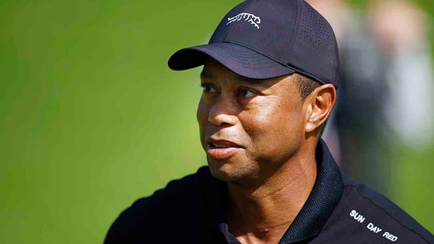 Tiger Woods looks on as he practices prior to the 2024 Genesis Invitational at Riviera Country Club in Pacific Palisades, Calif.